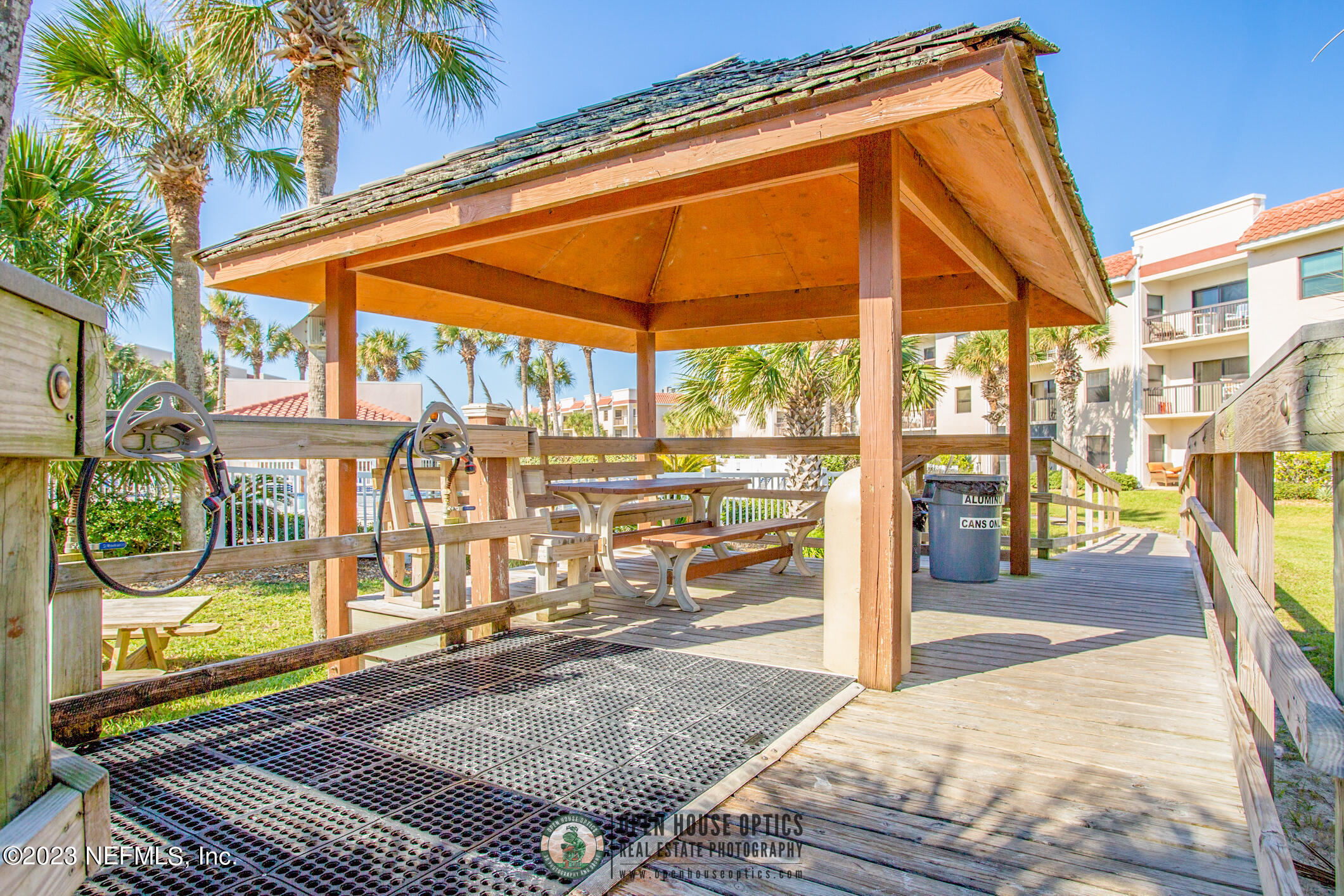 4250 Florida A1A, Unit I26 St. Augustine, FL 32080 - Photo 36 of 49 a view of a porch with a table and chairs under an umbrella