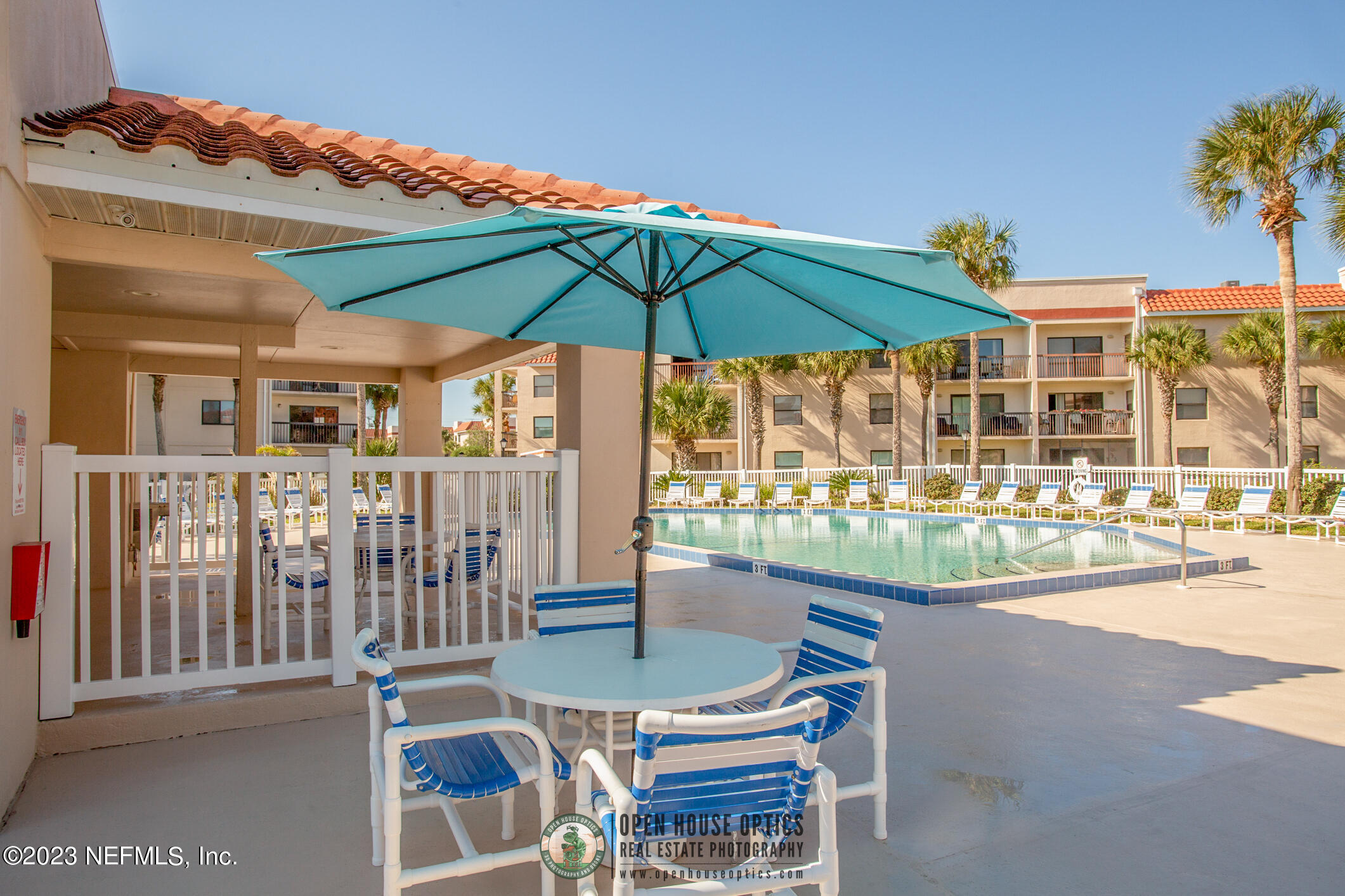 4250 Florida A1A, Unit I26 St. Augustine, FL 32080 - Photo 42 of 49 a view of a patio with a table and chairs under an umbrella