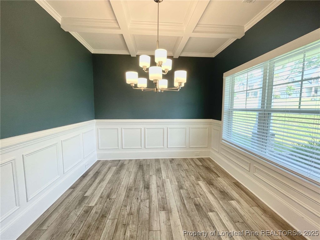 356 Kensington Drive Spring Lake, NC 28390 - Photo 26 of 28 a view of an empty room with a window and wooden floor