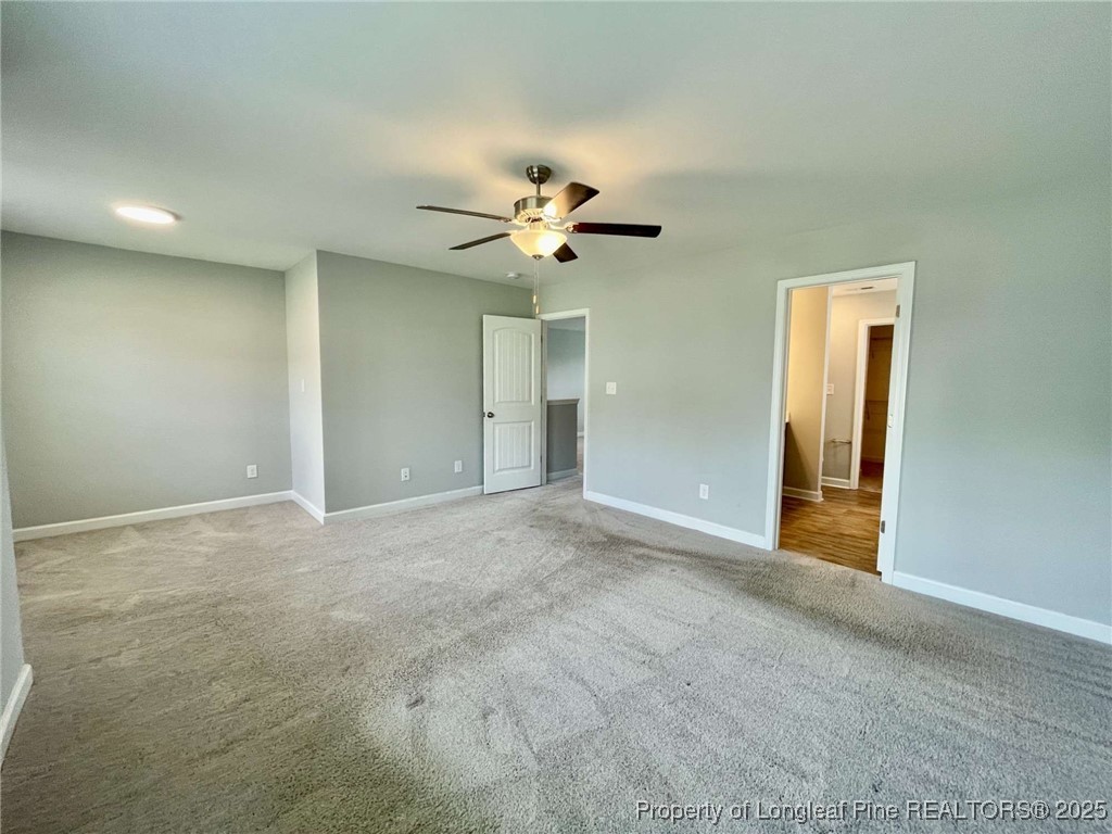 356 Kensington Drive Spring Lake, NC 28390 - Photo 5 of 28 a view of an empty room with a ceiling fan