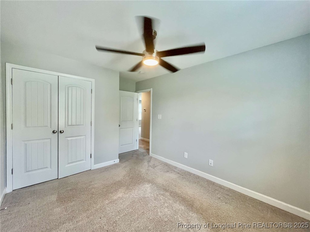 356 Kensington Drive Spring Lake, NC 28390 - Photo 10 of 28 an empty room with closet and a chandelier fan