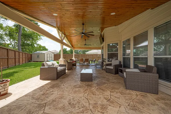 a view of a patio with couches and chairs