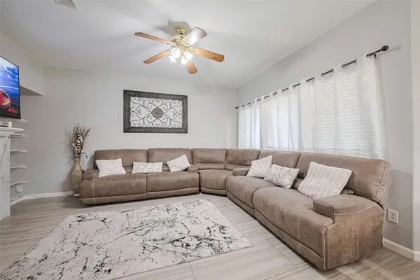 a living room with furniture and a large window