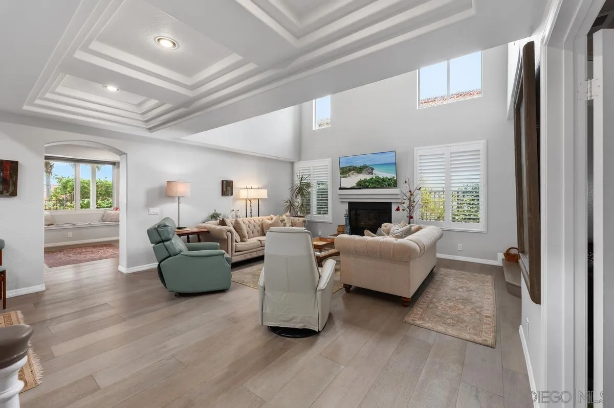 7521 Navigator Circle Carlsbad, CA 92011 - Photo 1 of 41 a living room with furniture a fireplace and a window
