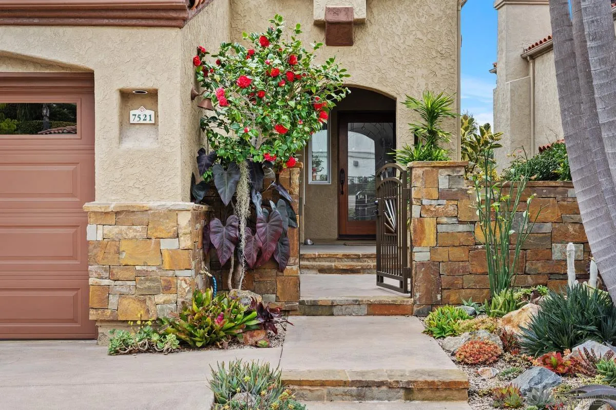 7521 Navigator Circle Carlsbad, CA 92011 - Photo 5 of 41 a flower plants sitting in front of a house