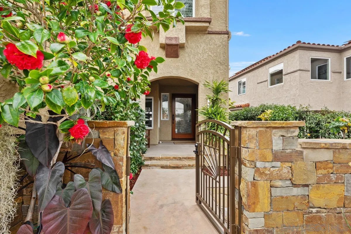 7521 Navigator Circle Carlsbad, CA 92011 - Photo 6 of 41 a view of a house with a flower garden