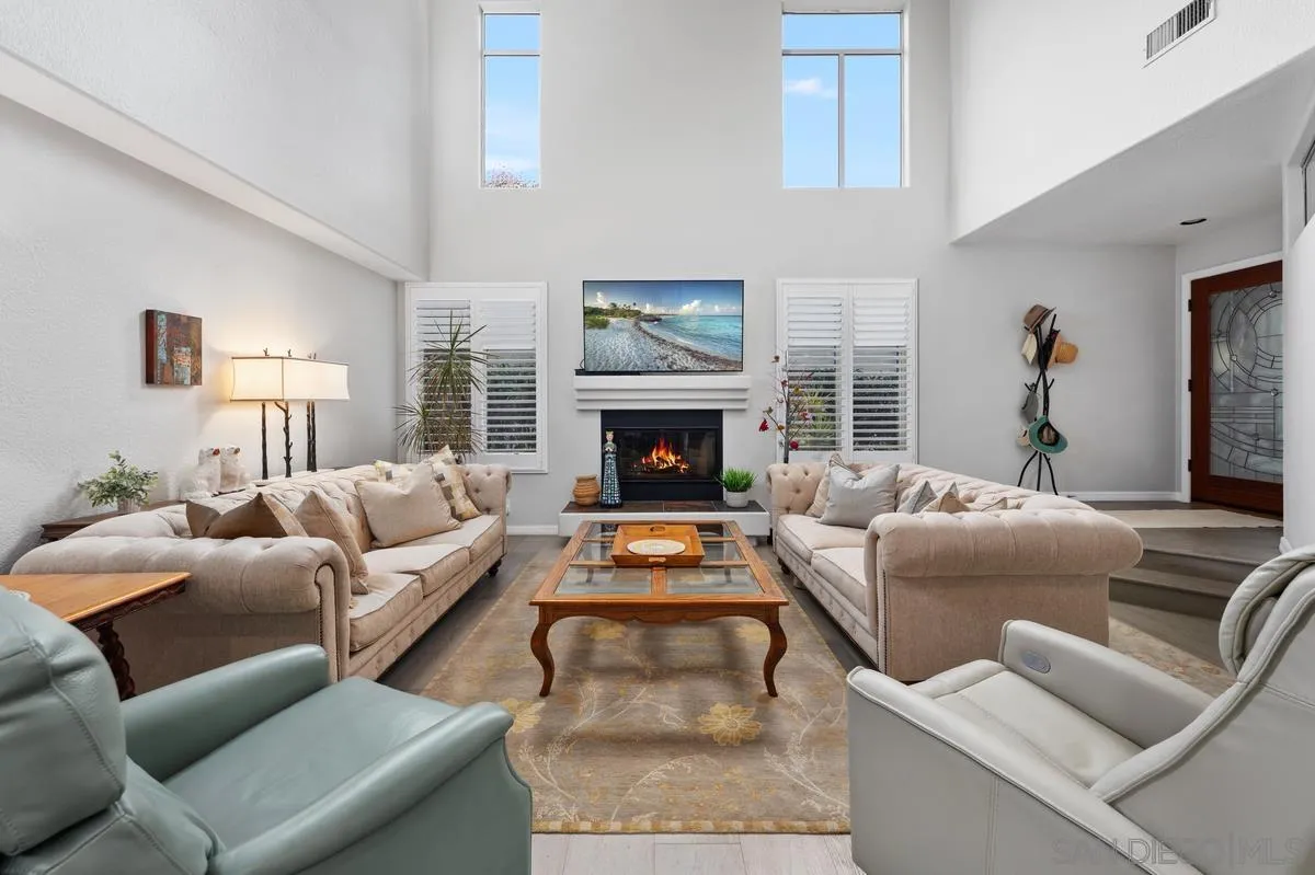 7521 Navigator Circle Carlsbad, CA 92011 - Photo 9 of 41 a living room with furniture and a fireplace