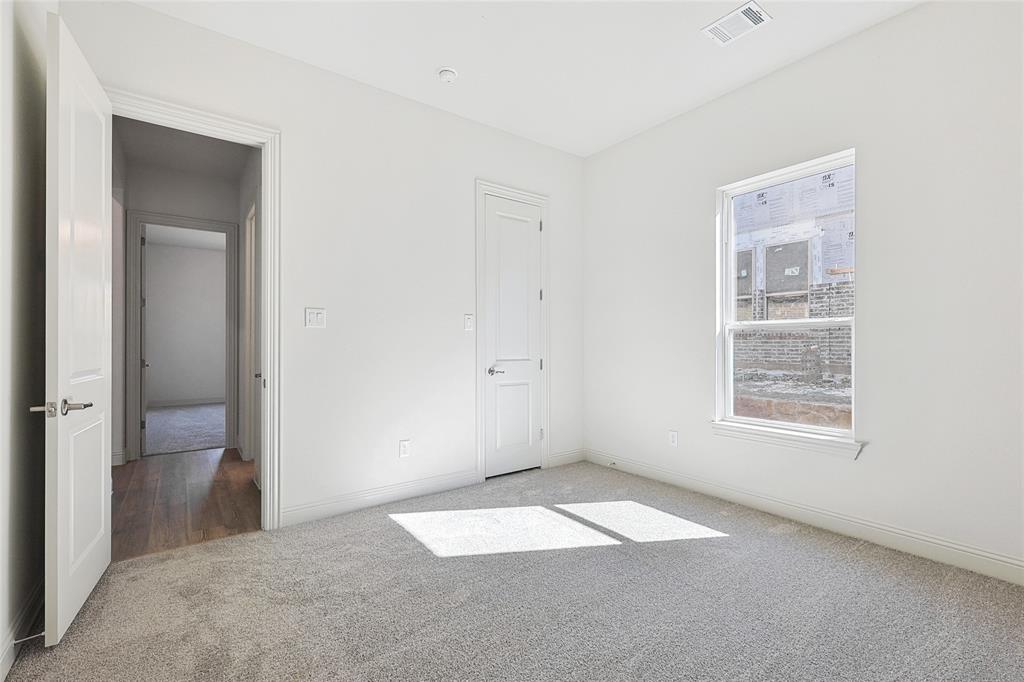 313 Trinity Court Shady Shores, TX 76208 - Photo 20 of 24 Unfurnished bedroom with carpet and baseboards