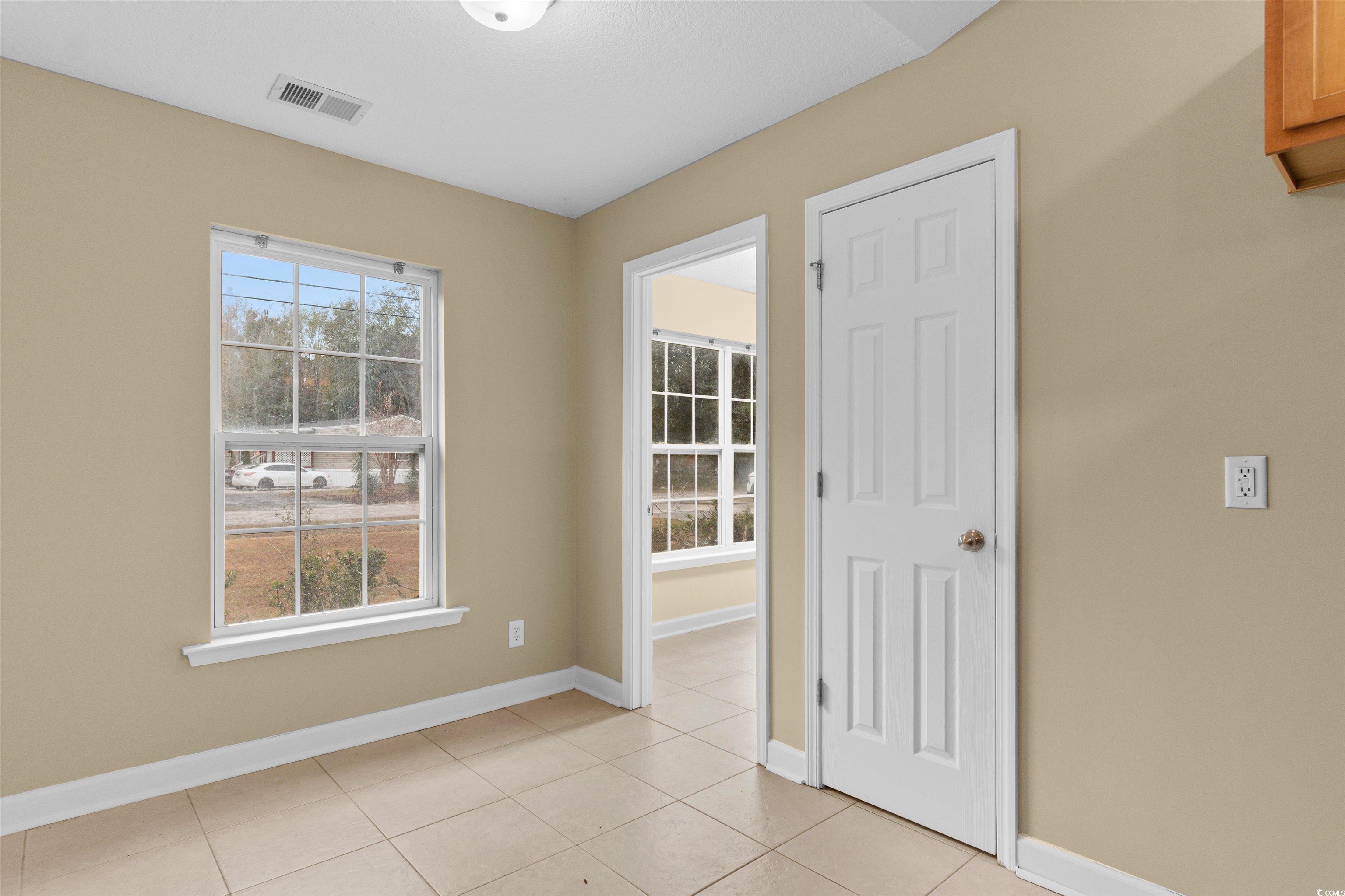 85 Graham Road Georgetown, SC 29440 - Photo 12 of 39 Empty room with baseboards and light tile patterned floors