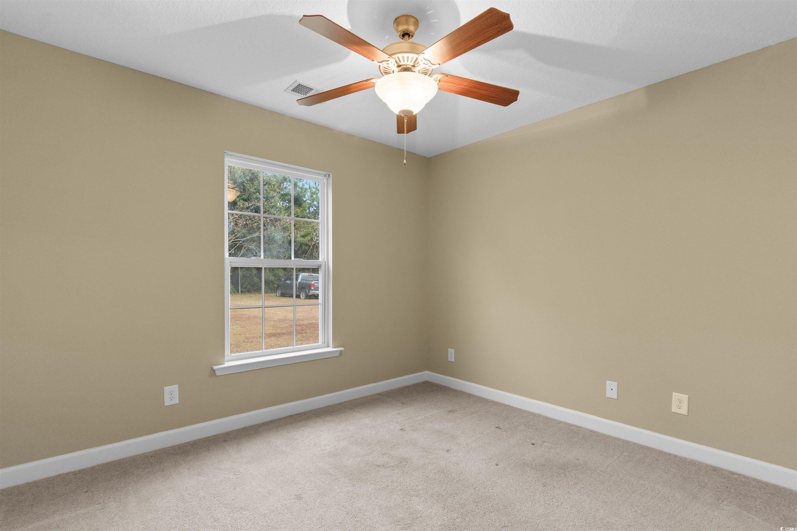 85 Graham Road Georgetown, SC 29440 - Photo 25 of 39 Unfurnished room with light carpet and ceiling fan