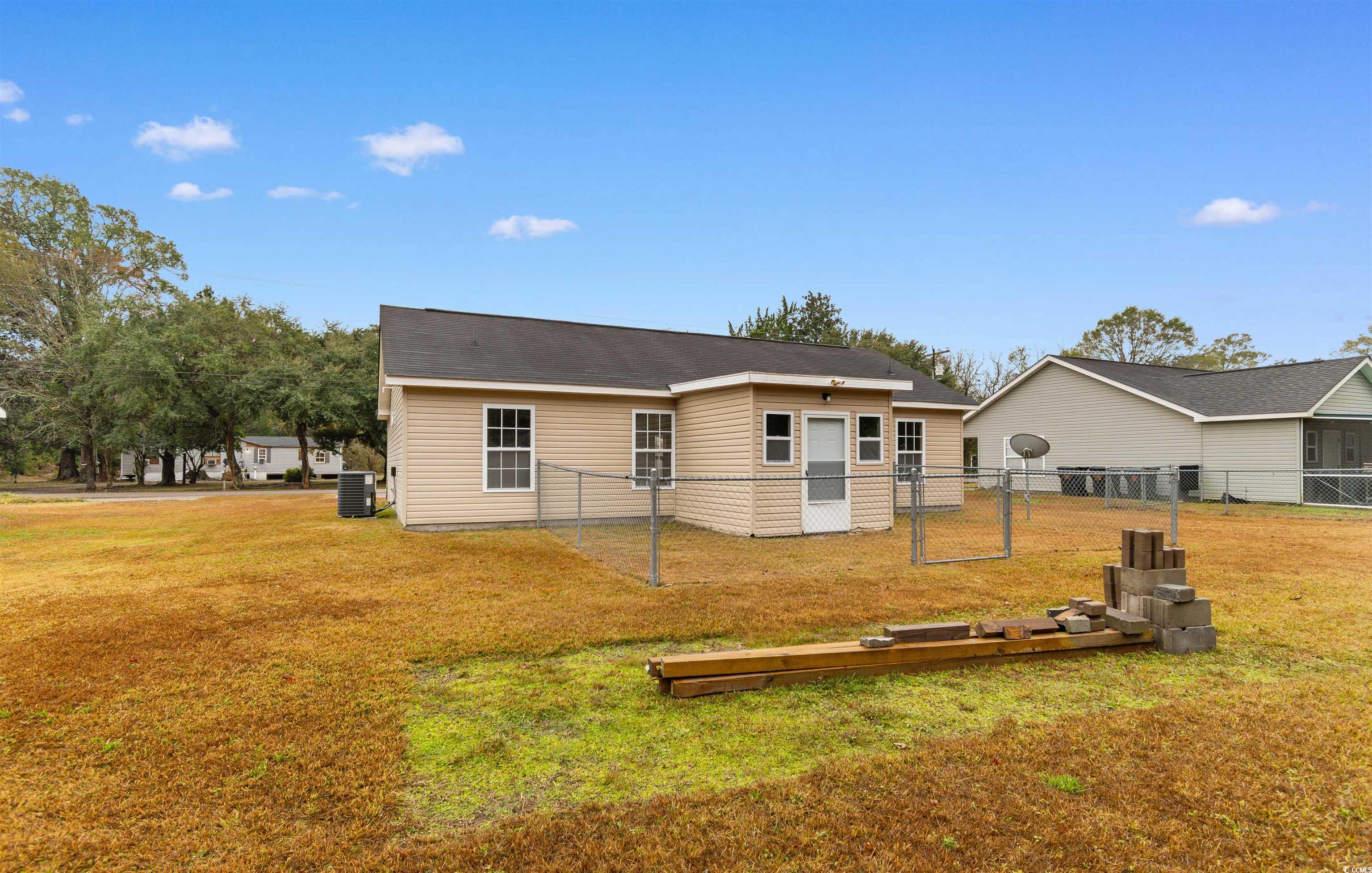 85 Graham Road Georgetown, SC 29440 - Photo 30 of 39 Rear view of property featuring a gate