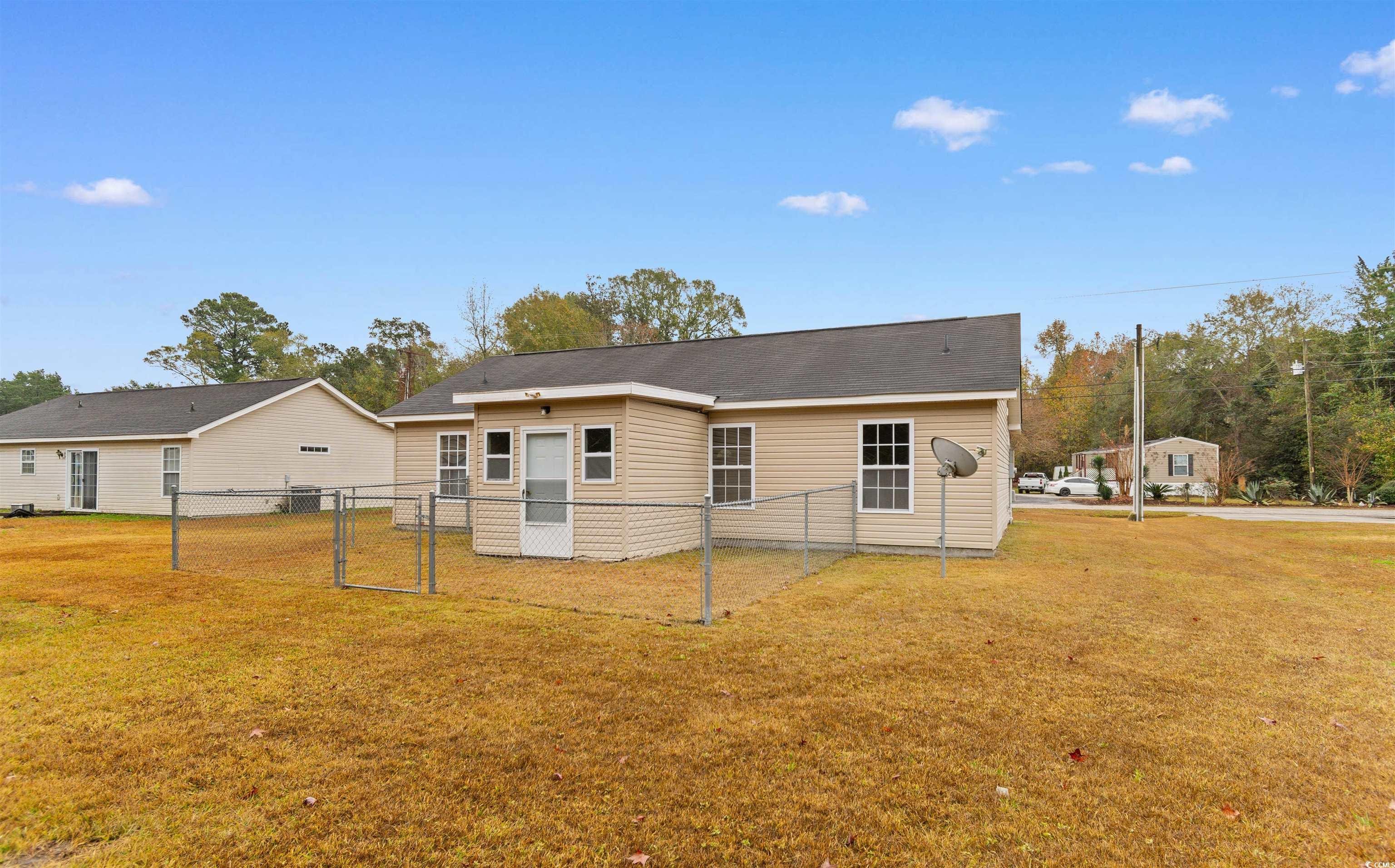 85 Graham Road Georgetown, SC 29440 - Photo 31 of 39 Rear view of property featuring a gate