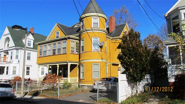 31 Howland Street Boston, MA 02121 - Photo 4 of 4 a front view of a residential apartment building with a yard