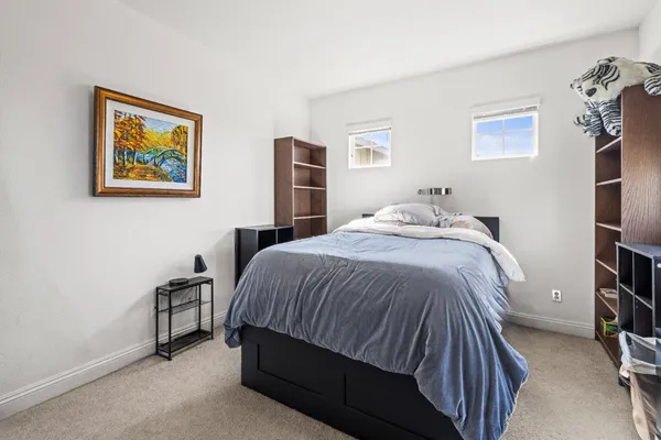 a bedroom with a bed and dresser