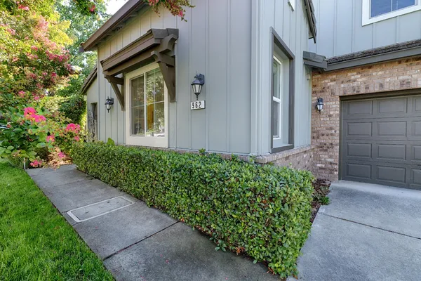 a front view of a house with a yard