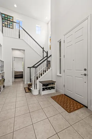 a view of an entryway with wooden floor