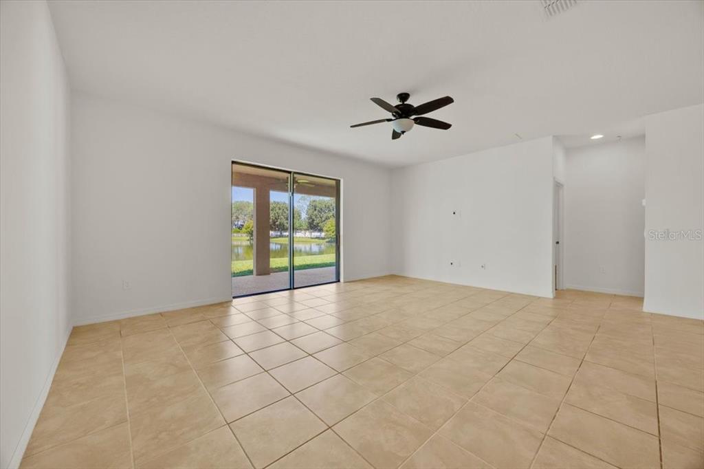 8755 Rindge Road Polk City, FL 33868 - Photo 12 of 25 a view of an empty room with a window