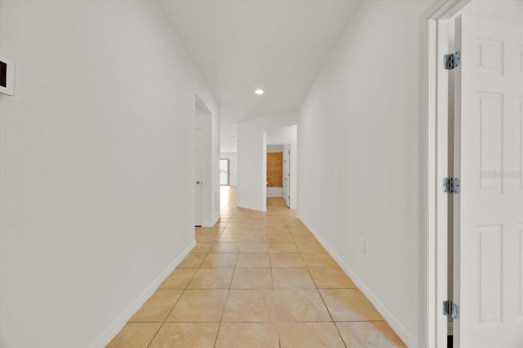8755 Rindge Road Polk City, FL 33868 - Photo 13 of 25 a view of a hallway with a white walls