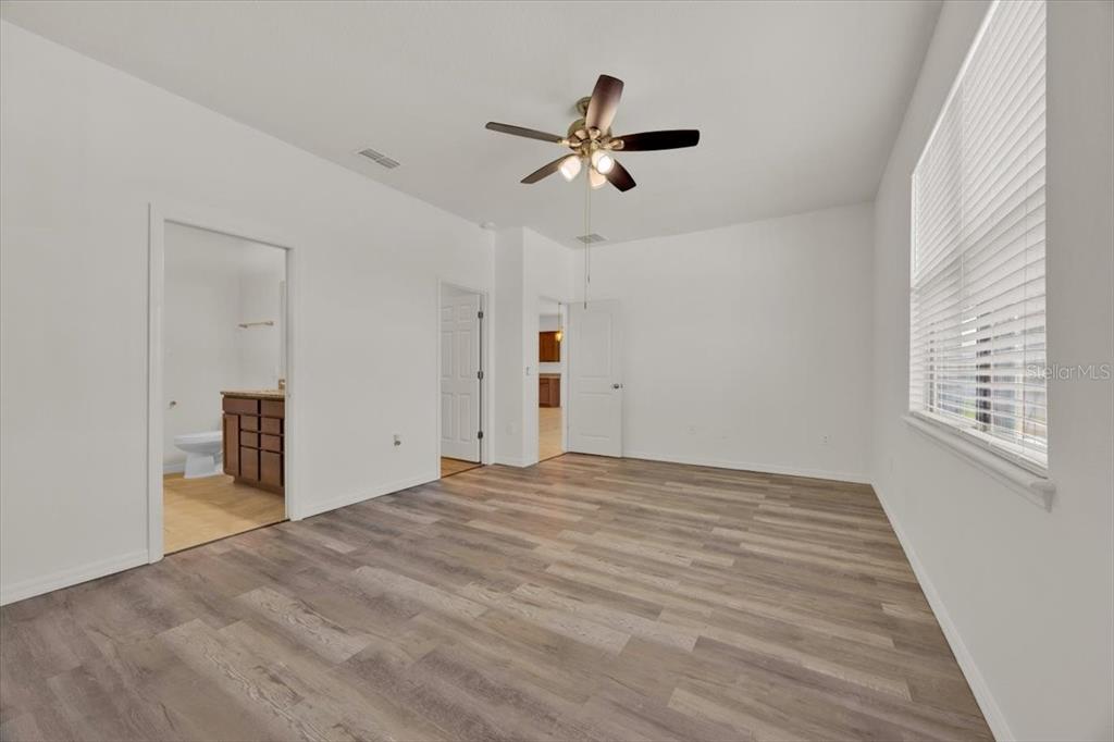 8755 Rindge Road Polk City, FL 33868 - Photo 18 of 25 a view of a livingroom with a ceiling fan and window