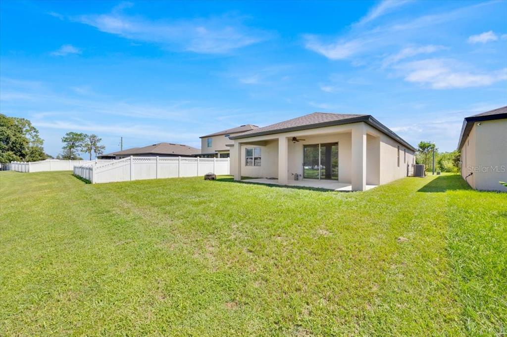 8755 Rindge Road Polk City, FL 33868 - Photo 5 of 25 a view of a house with a backyard