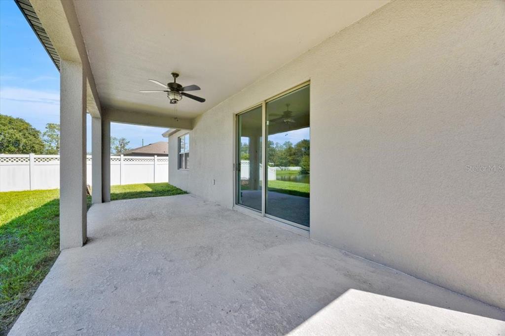 8755 Rindge Road Polk City, FL 33868 - Photo 7 of 25 a view of an empty room with a fireplace and a window