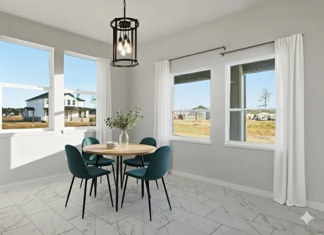 an empty room with a ceiling fan and carpet