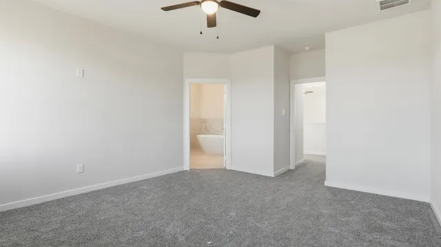 a bathroom with a white tub shower and sink