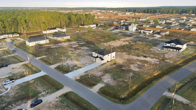 an aerial view of residential house with ocean view