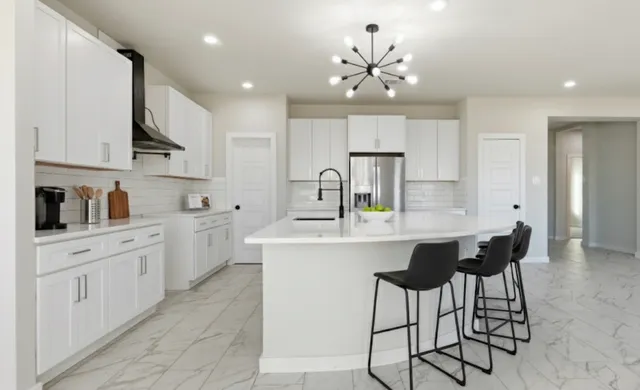 a kitchen with cabinets a sink and appliances
