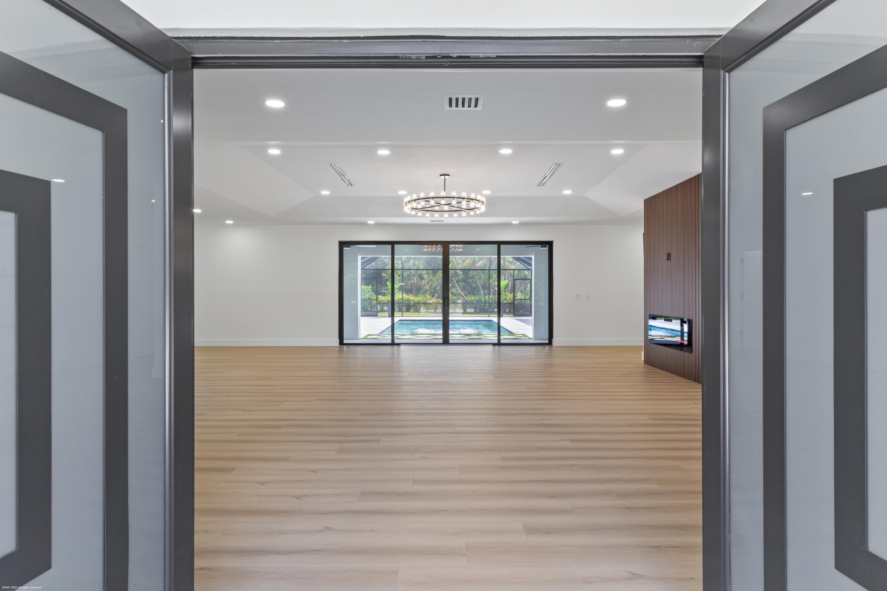 13453 Doubletree Trail Wellington, FL 33414 - Photo 9 of 65 a view of an empty room with a window