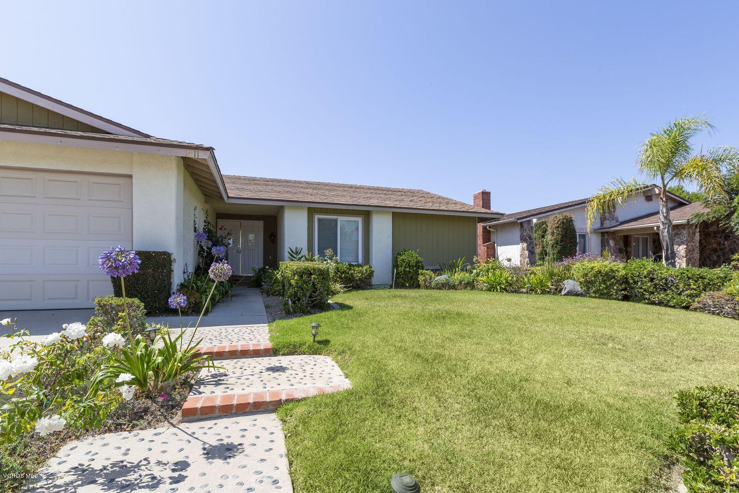 1411 Kelp Street Oxnard, CA 93035 - Photo 2 of 24 a front view of a house with garden