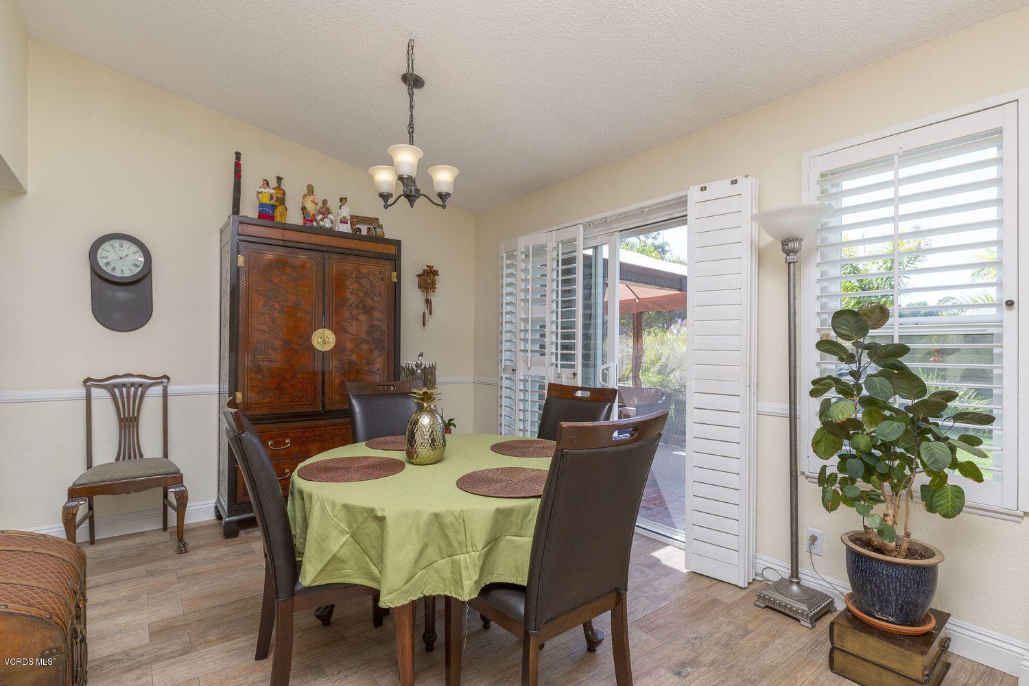1411 Kelp Street Oxnard, CA 93035 - Photo 12 of 24 a view of a dining room with furniture window and wooden floor