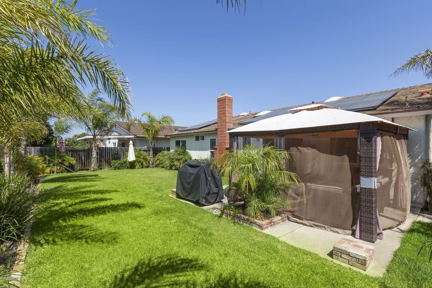 1411 Kelp Street Oxnard, CA 93035 - Photo 20 of 24 a front view of a house with a yard