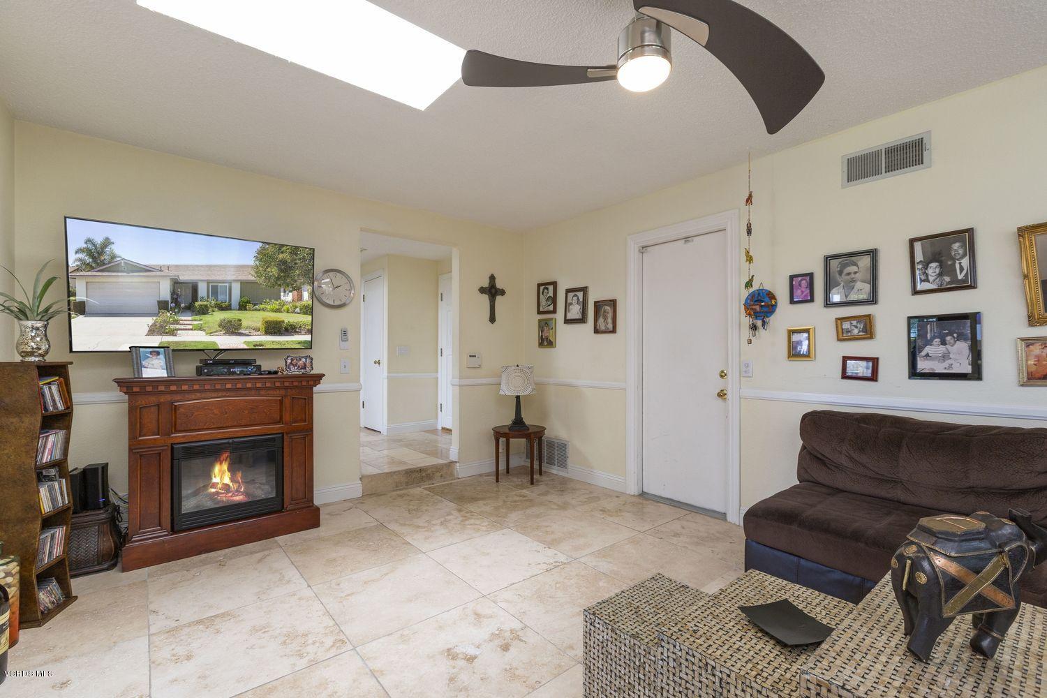 1411 Kelp Street Oxnard, CA 93035 - Photo 5 of 24 a living room with furniture and a fireplace
