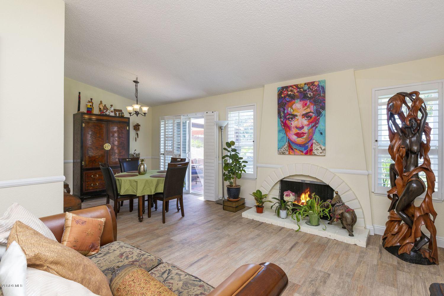 1411 Kelp Street Oxnard, CA 93035 - Photo 9 of 24 a living room with furniture and a fireplace