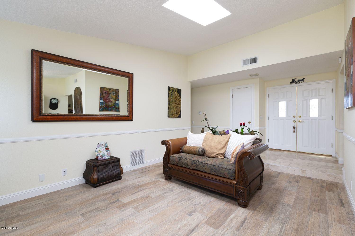 1411 Kelp Street Oxnard, CA 93035 - Photo 10 of 24 a living room with furniture and a wooden floor