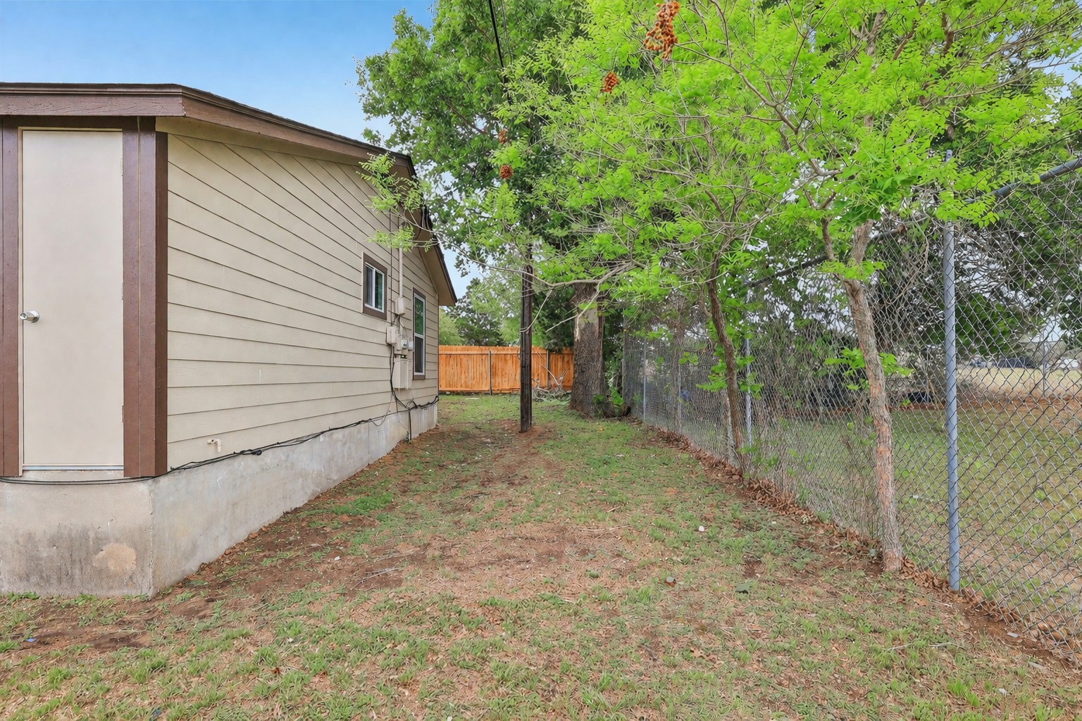 200 Monterrey Street, Unit A & B Elgin, TX 78621 - Photo 30 of 32 View of back of duplex and yard - 200 Monterrey, Elgin, TX 78621