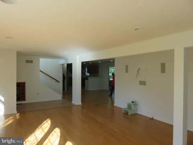 a kitchen with stainless steel appliances granite countertop a refrigerator a sink a stove a microwave and island