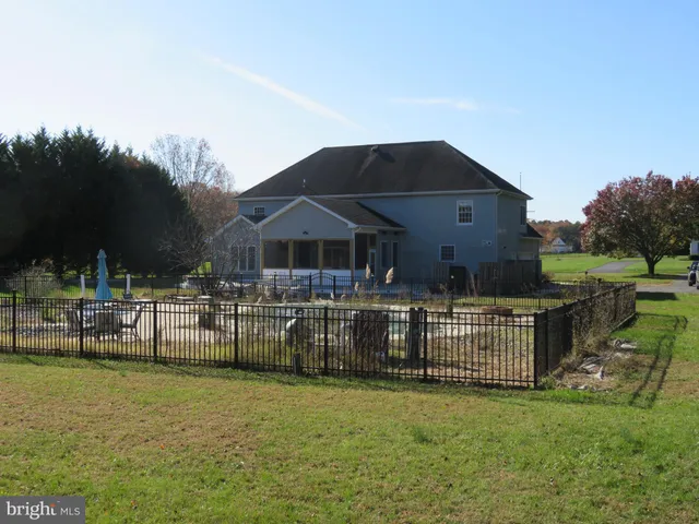 a front view of house with yard and outdoor seating