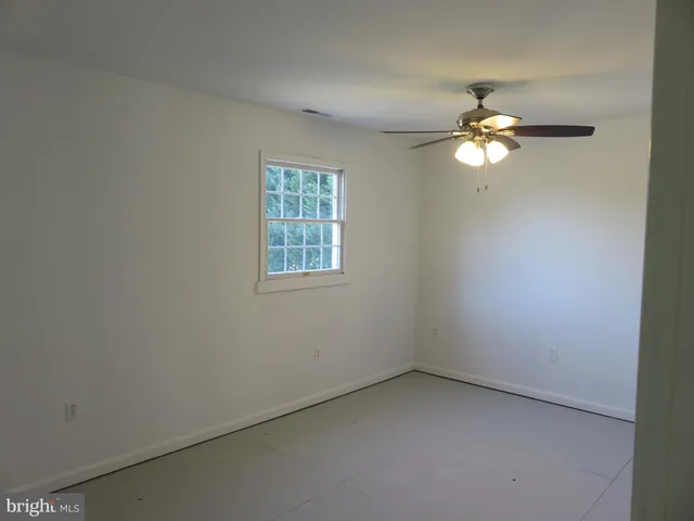 a view of a balcony next to a yard