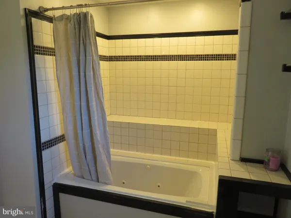 a wooden bench sitting in the middle of a lake