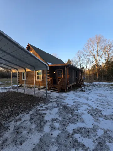 a view of a house with a backyard