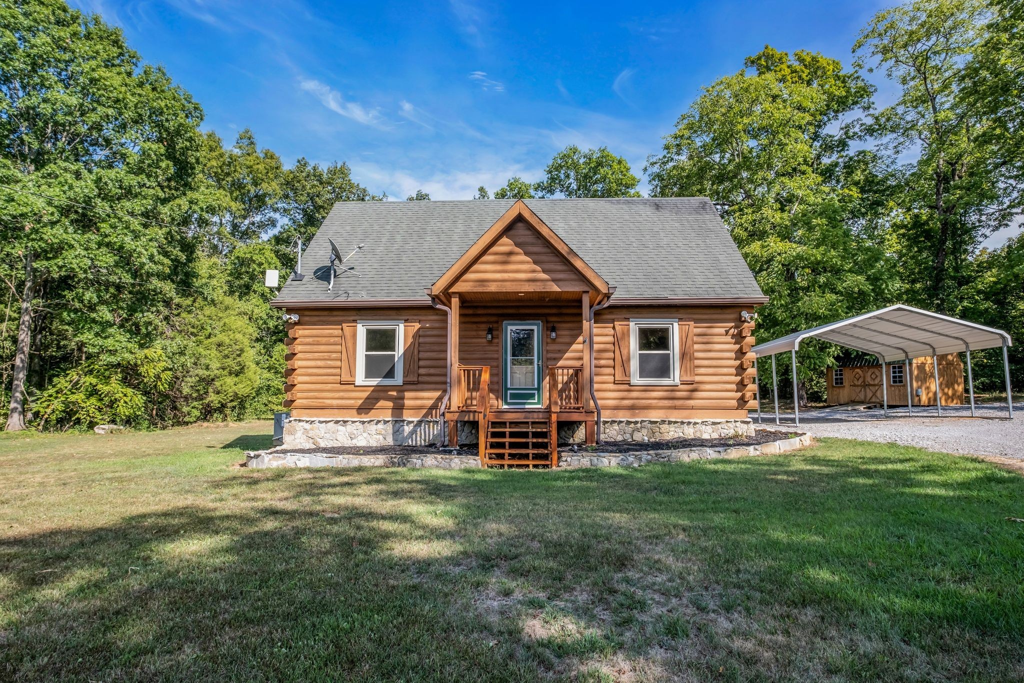 2002 Luther Sharp Road Columbia, TN 38401 - Photo 2 of 18 a front view of a house with a garden and porch