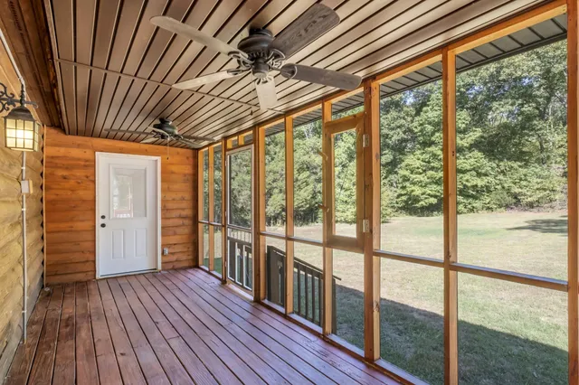 a view of hallway with wooden floor