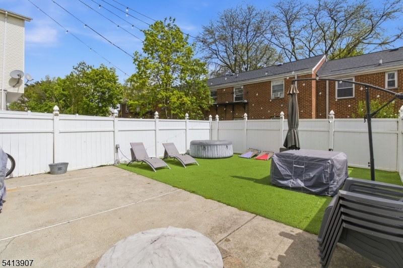 32 Cedar Avenue Elizabeth, NJ 07202 - Photo 31 of 32 a view of a house with a yard and sitting area