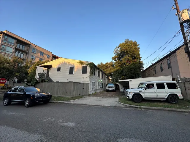 a car parked in front of a house
