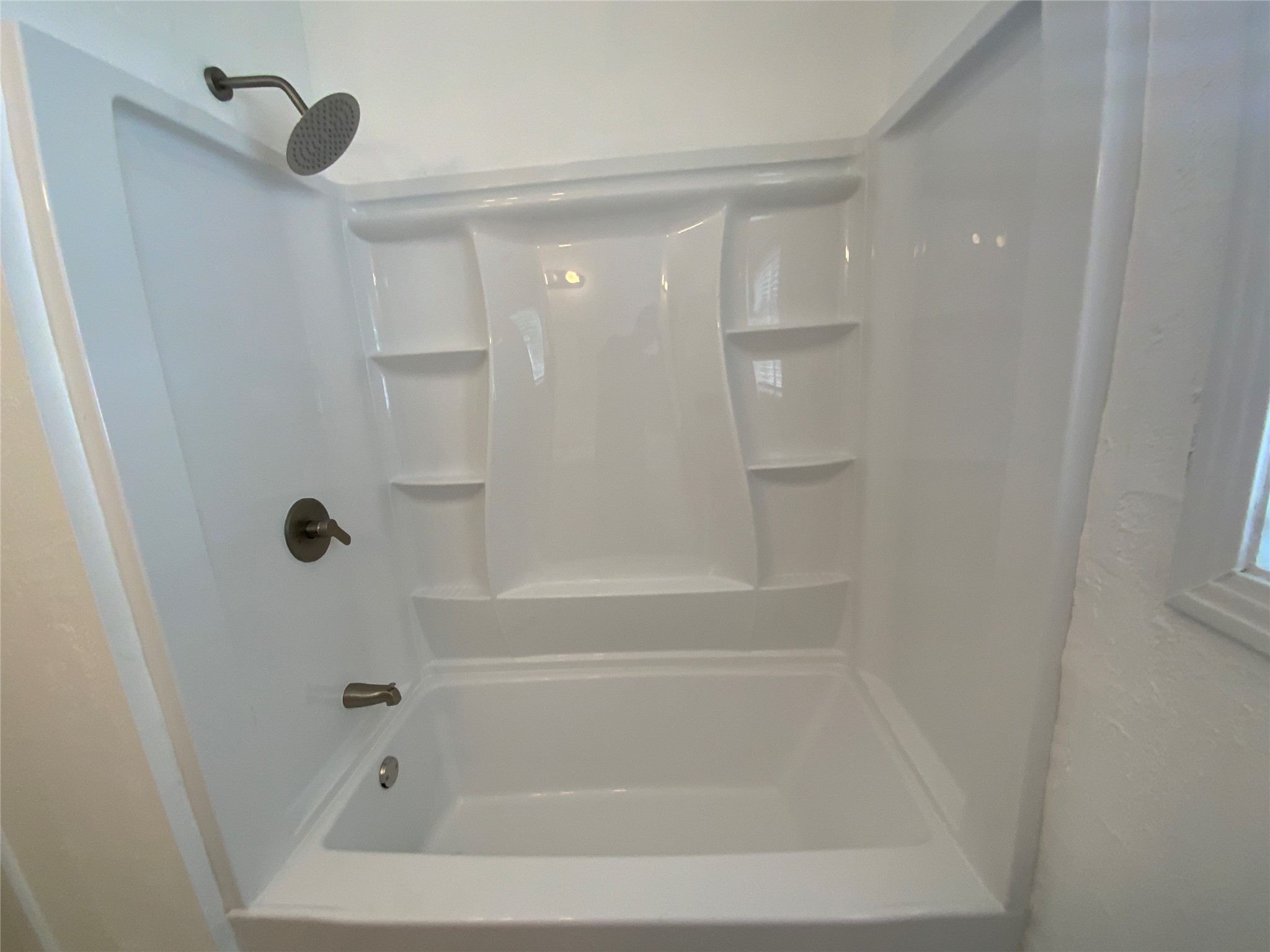 2327 Branard Street, Unit 5 Houston, TX 77098 - Photo 12 of 17 a close view of a bathtub in a bathroom
