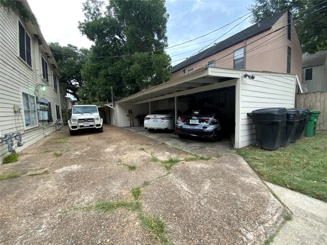 a view of a car parked in the yard