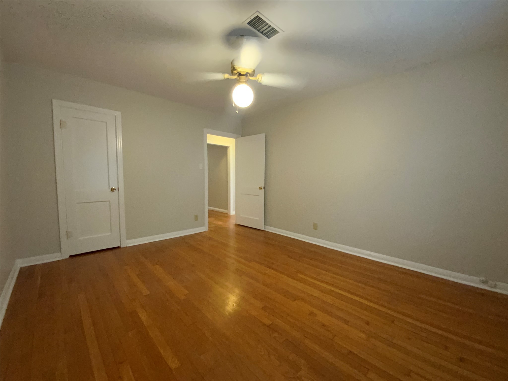2327 Branard Street, Unit 5 Houston, TX 77098 - Photo 7 of 17 a view of an empty room with a chandelier fan