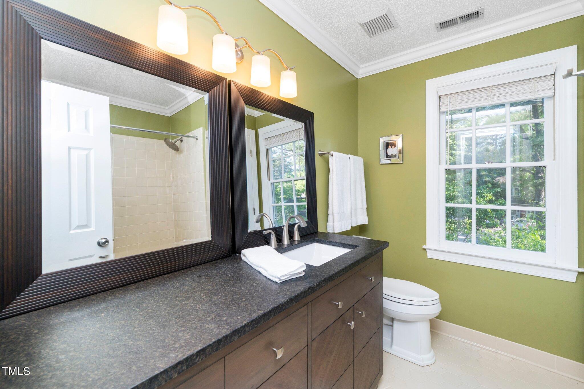 1712 Briarforest Place Raleigh, NC 27615 - Photo 29 of 55 Full. bathroom on the second floor features a tub/shower combination with a tiled wall surround.